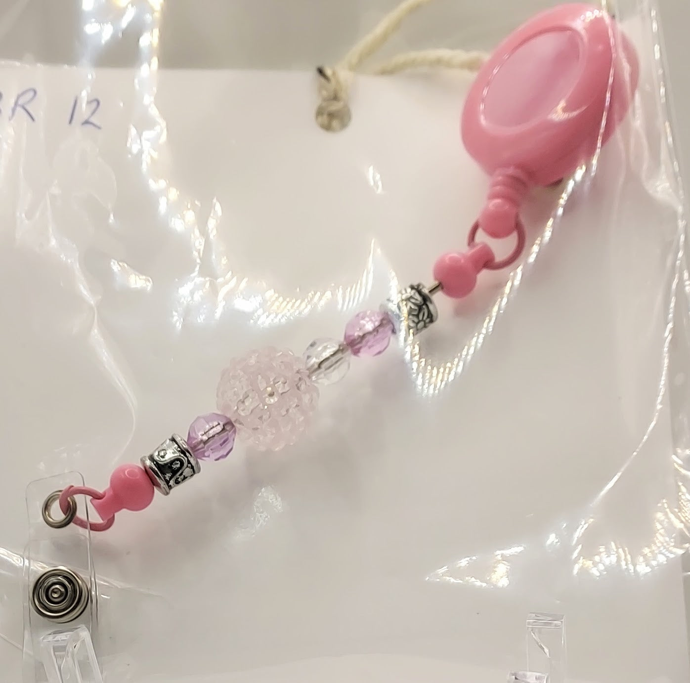 One of a Kind Pink Fidget Badge Reel