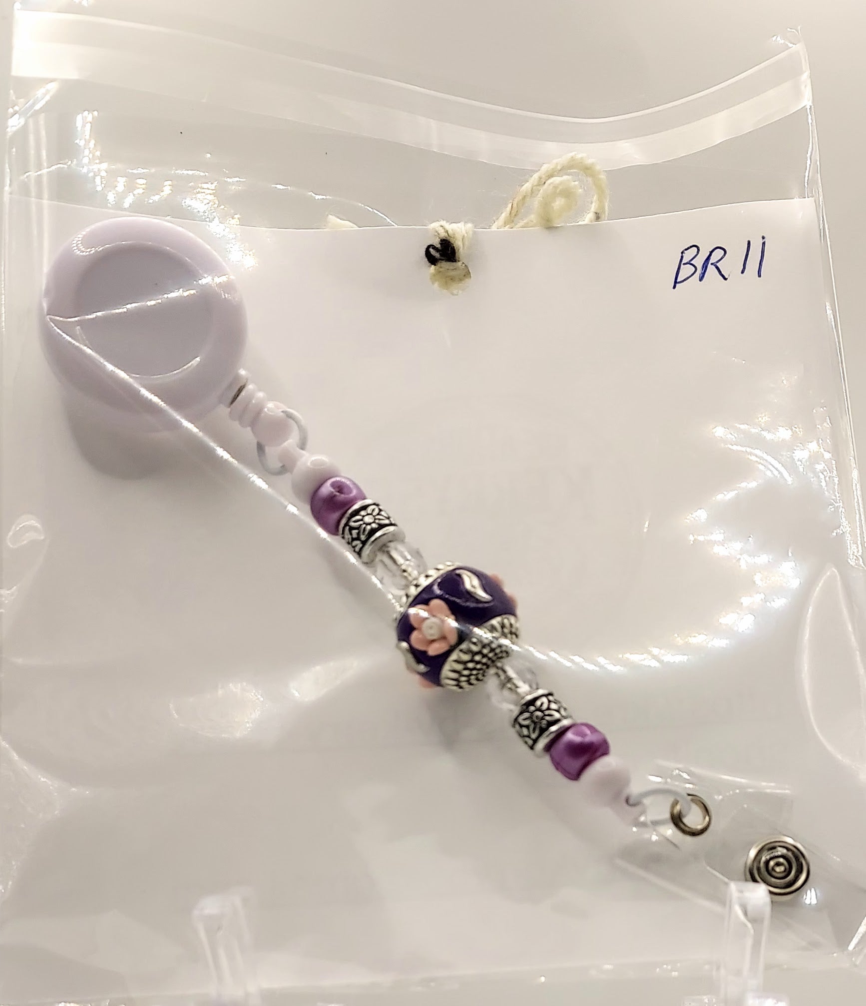 One of a Kind Purple and White Badge Reel