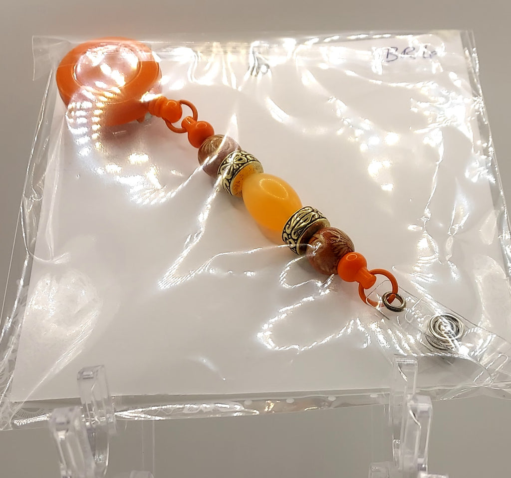One of a Kind Orange Badge Reel