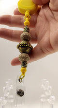 Unique Sunny Yellow and Gold Fidget Badge Reel