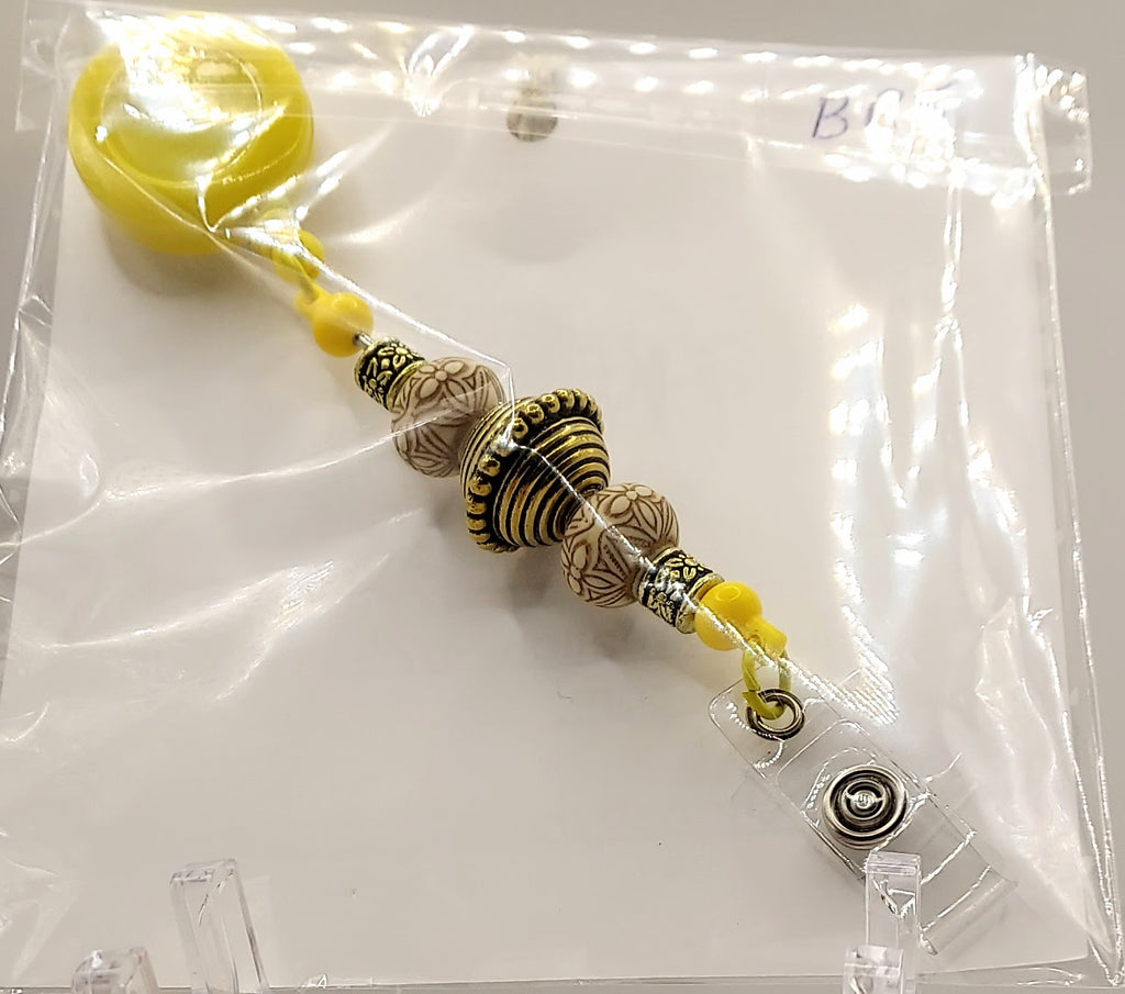 Unique Sunny Yellow and Gold Fidget Badge Reel
